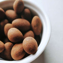 Load image into Gallery viewer, COCOVA Cheeky Hazel 68% Dark Chocolate Coated Hazelnuts (130g) - Thehivebulkfoods